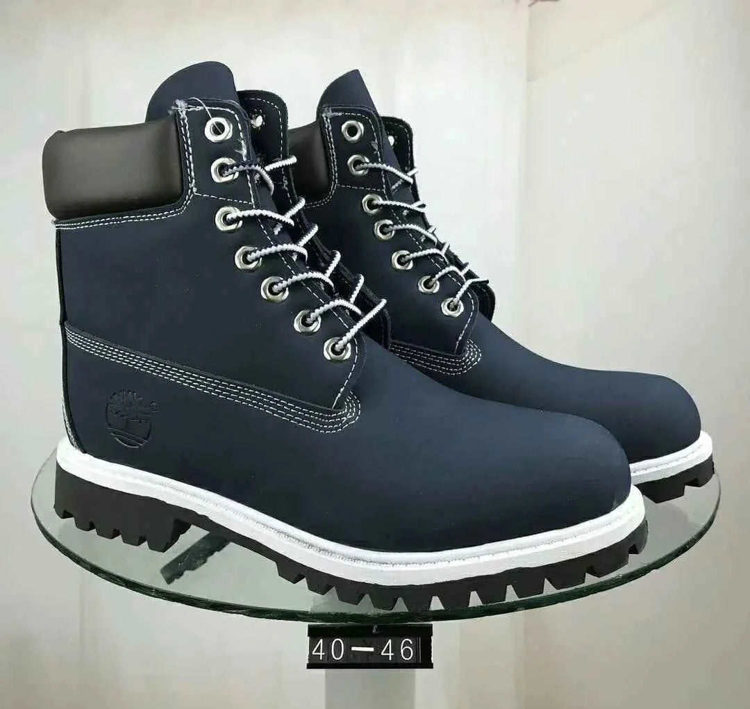 Navy blue waterproof leather work boots for men and women by Mead's Supply, slip-resistant and rugged for work and outdoor trails.