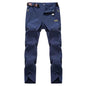 Men's black and grey quick-drying outdoor hiking pants from Mead's Supply & Equipment, waterproof, anti-UV, and breathable trekking apparel.