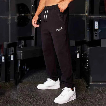 Men's black athletic joggers with side stripe from Mead's Supply & Equipment Outfitters, designed for comfort and active wear.