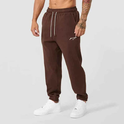 Men's black athletic joggers with side stripe, made by Mead's Supply & Equipment Outfitters, featuring comfortable track sweatpants.