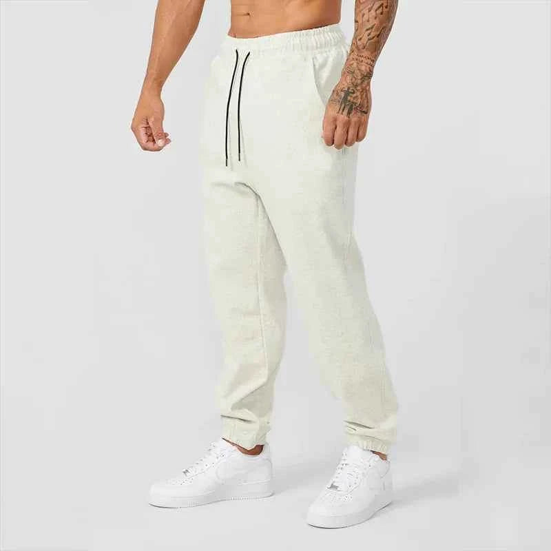 Men's black athletic joggers with side stripe from Mead's Supply & Equipment Outfitters, featuring a comfortable fit and tapered design.