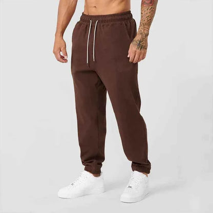 Men's black athletic joggers with side stripe from Mead's Supply & Equipment Outfitters, featuring a comfortable fit and sporty style.