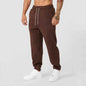 Men's black athletic joggers with side stripe from Mead's Supply & Equipment Outfitters, featuring a comfortable fit and tapered design.