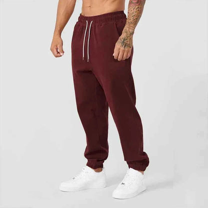 Men's black athletic joggers with side stripe, made by Mead's Supply & Equipment Outfitters, featuring a comfortable fit and athletic style.