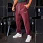 Men's black athletic joggers with side stripe from Mead's Supply & Equipment Outfitters, made for comfortable active wear.
