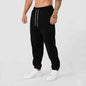 Men's black athletic track sweatpants with side stripe from Mead's Supply & Equipment Outfitters, designed for active wear and comfort.