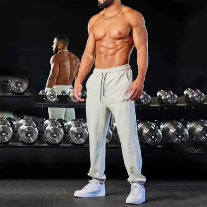 Men's black track sweatpants by Mead's Supply & Equipment Outfitters with athletic fit and side stripe for comfortable active wear.
