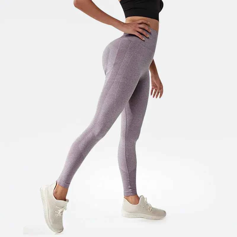 Black women's high waist yoga pants from Mead's Supply & Equipment Outfitters with a slim fit, quick-dry fabric, and hip-lifting design.