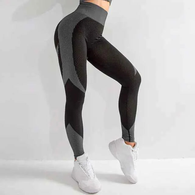 Black seamless hollow yoga pants for women by Mead's Supply & Equipment Outfitters, moisture-wicking breathable athletic leggings.