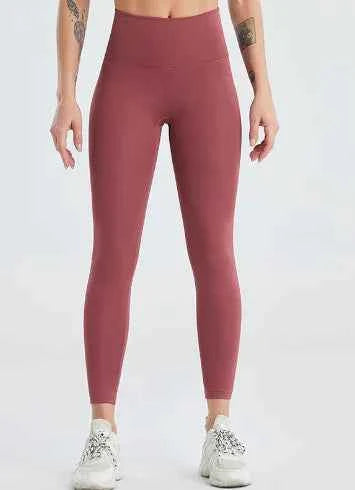 Women's quick dry high-waisted yoga pants by Mead's Supply & Equipment Outfitters, in brown and red, designed for gym and fitness activities.