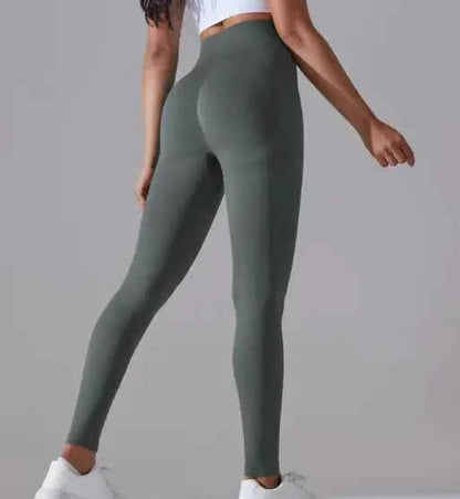 Brown knitted high-waist yoga pants by Mead's Supply & Equipment Outfitters, soft stretch activewear for women, close-up of fabric and fit.