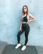 Seamless snake print yoga set for women by Mead's Supply & Equipment, moisture-wicking 2-piece activewear fitness outfit in deep grey.