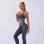 Seamless snake print yoga set for women by Mead's Supply & Equipment, featuring moisture-wicking activewear in deep grey.