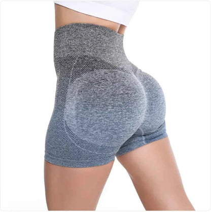 Women's high-waist gradient yoga shorts in green by Mead's Supply & Equipment Outfitters, designed for athletic workouts and fitness.