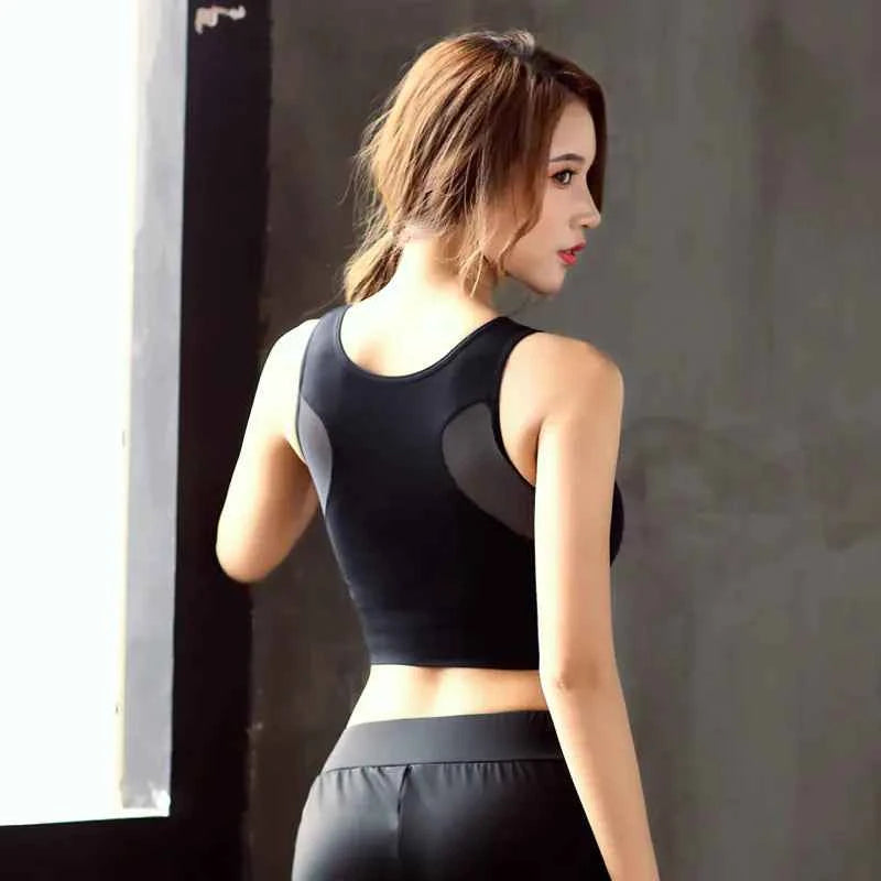 Green women's quick-dry yoga activewear set by Mead's Supply & Equipment Outfitters, featuring breathable workout clothing for exercise.