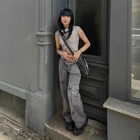 Women’s grey street retro low-rise denim cargo pants by Mead's Supply & Equipment Outfitters, featuring classic cargo pockets and relaxed fit.