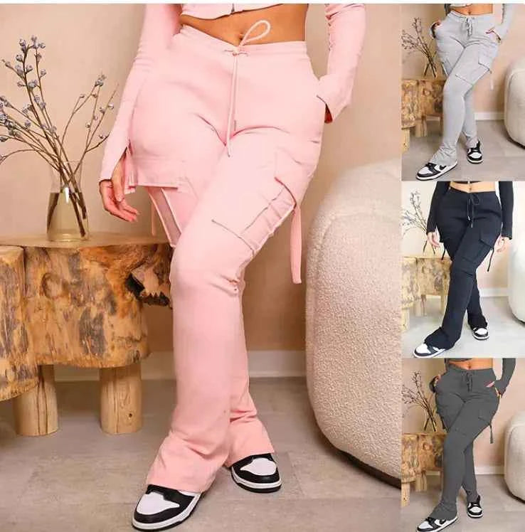 Pink high-waist utility cargo pants for women with wide legs and multiple pockets, featuring a drawstring waist from Mead's Supply & Equipment.