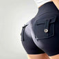 Women's high waist stretch yoga shorts by Mead's Supply & Equipment Outfitters, quick-dry athletic shorts for gym and fitness, white color.