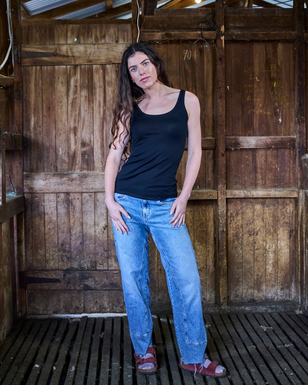 Women's black scoop neck tank top made from 100% Merino wool by Merino 365 NZ, perfect for comfortable layering.