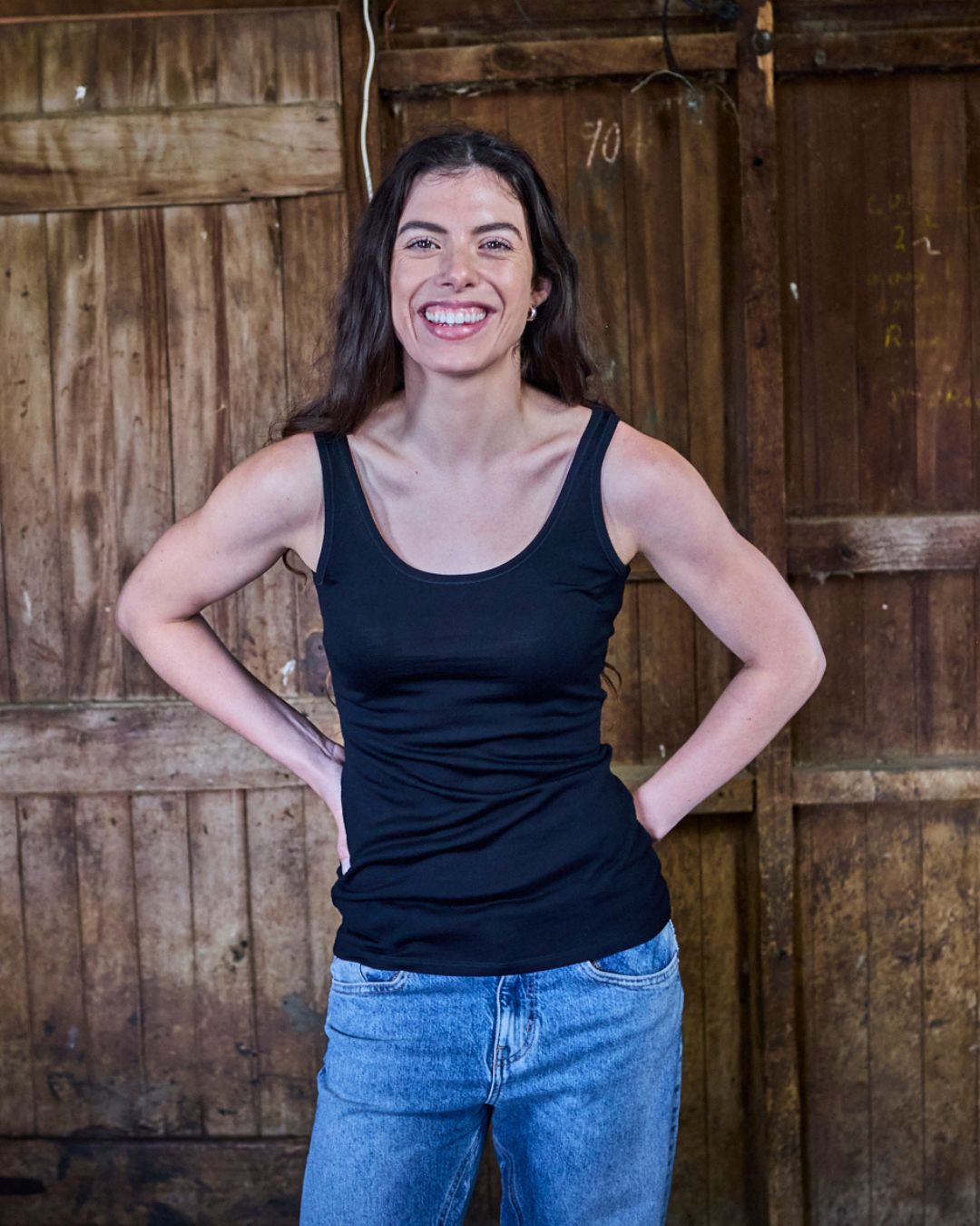 Black women's scoop neck tank top made from 100% Merino wool by Merino 365 NZ, lightweight and soft for everyday wear.