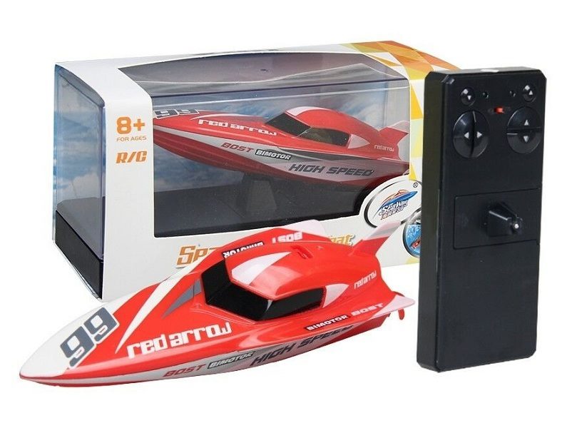 Red remote control racing boat by dealonline.co.nz, speeding on water with sleek design and vibrant color.