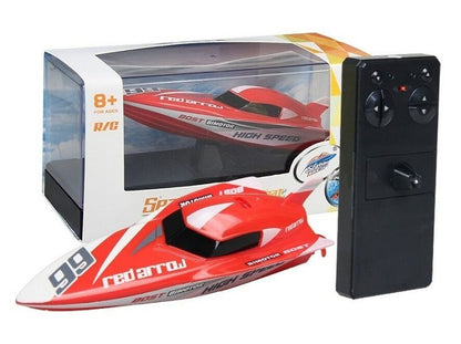 Red remote control racing boat by dealonline.co.nz, speeding on water with sleek design and vibrant color.