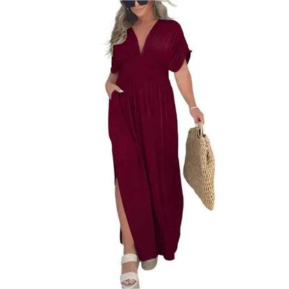 Stylish 3Sixty5 khaki summer dress with a slit, featuring a chic, flowy design perfect for warm weather.