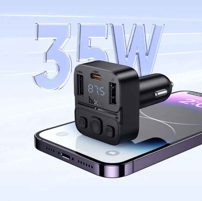 Techplus Hoco E87 dual port 35W car Bluetooth FM transmitter connected to a vehicle's dashboard.