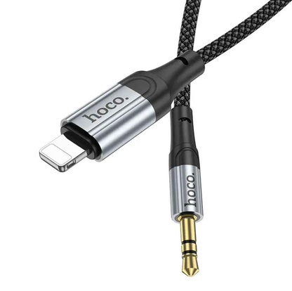 Techplus Hoco Lightning to 3.5mm aux cable connected to a device, showing flexible cable and connector for audio transfer.