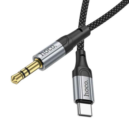 Techplus Hoco USB-C to 3.5mm Aux Cable UPA26 connected to a smartphone for audio output.