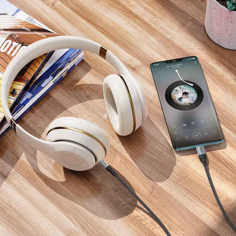 TechPlus Hoco USB-C to 3.5mm Aux Cable UPA26 connected to a device, showing durable cable and 3.5mm audio jack.