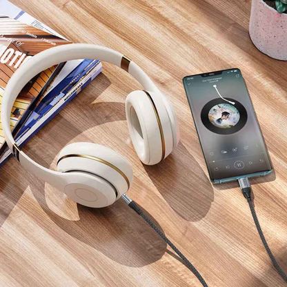 TechPlus Hoco USB-C to 3.5mm Aux Cable UPA26 connected to a device, showing durable cable and 3.5mm audio jack.