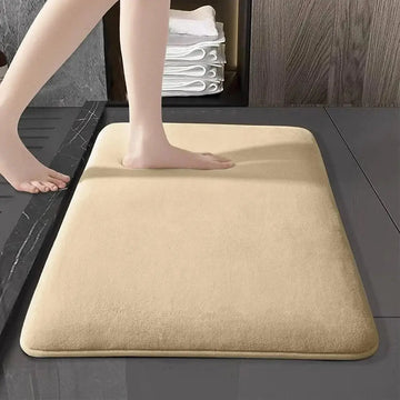 Habicare thick absorbent bathroom mat in solid color with non-slip backing, suitable for floor and door use, available in five colors.