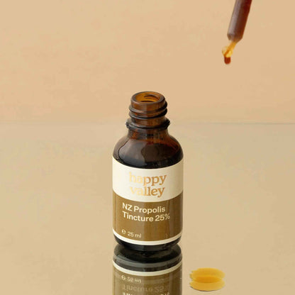 NZ Propolis Tincture 25% by Happy Valley Honey, a dark liquid in a glass dropper bottle, used for immune support and oral health.